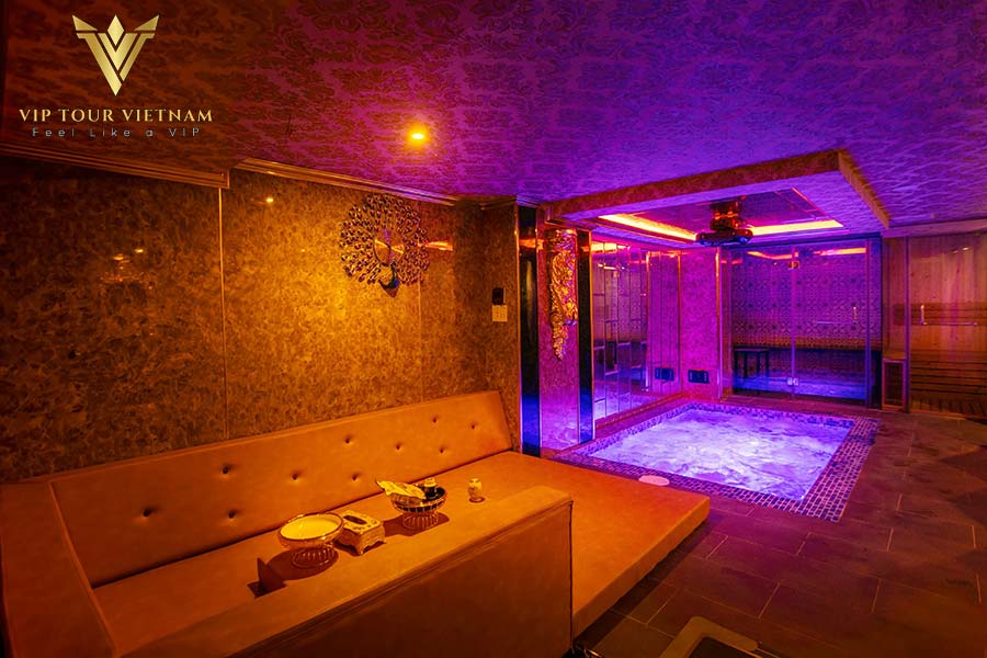 Wide onsen tub beside sofa, clean, warm, and inviting.