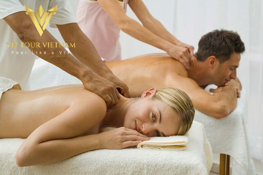 A couple entering a private, high-end spa suite for a shared erotic massage experience