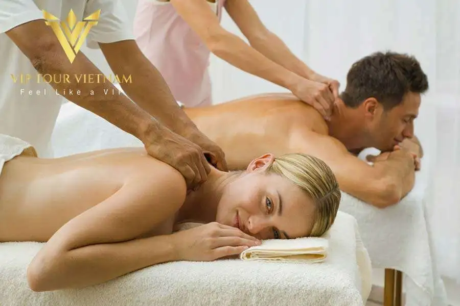 A couple entering a private, high-end spa suite for a shared erotic massage experience