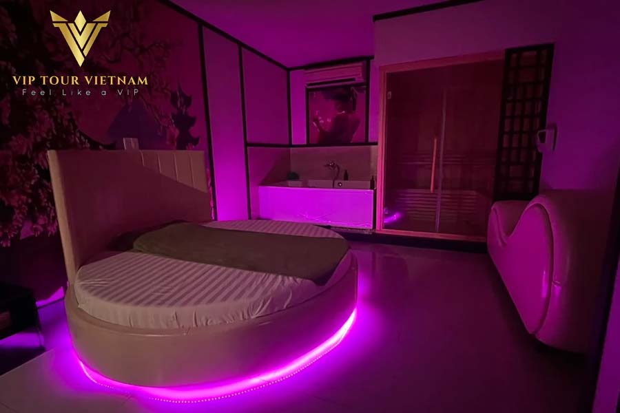 Round bed room with purple light – Nuru massage Da Nang