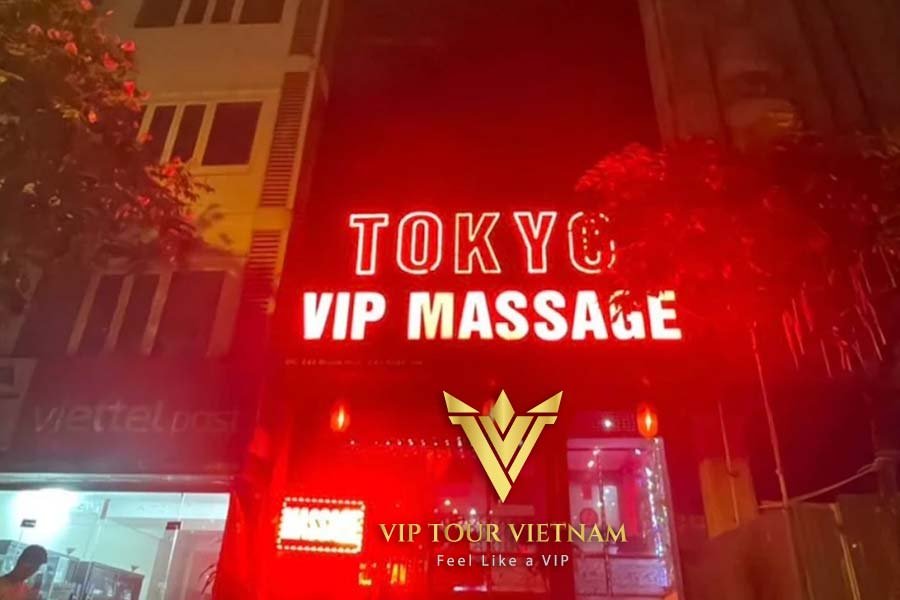 Look for the vibrant TOKYO VIP MASSAGE neon sign at 243 Quan Hoa street.